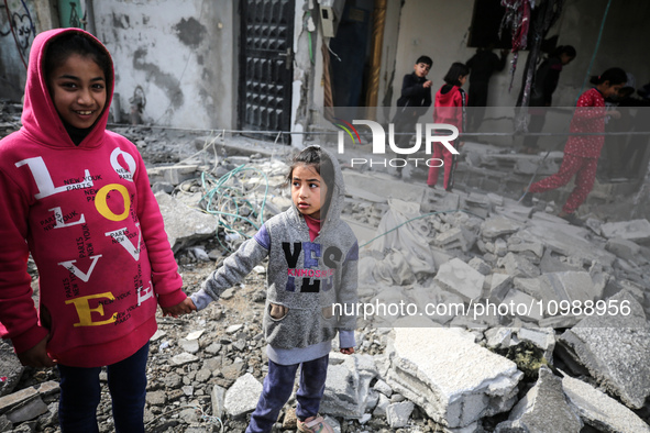 Palestinians are inspecting the damage caused by Israeli bombardment in Deir al-Balah, central Gaza Strip, on February 12, 2024, as battles...