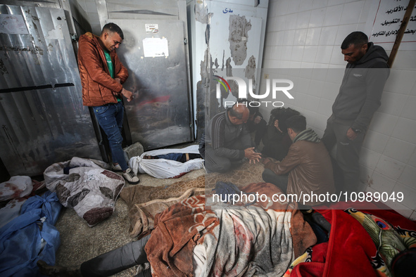 Palestinians are mourning their relatives, who were killed in an overnight Israeli strike on Deir al-Balah, during a mass funeral at the Al-...