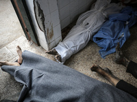 Palestinians are mourning their relatives, who were killed in an overnight Israeli strike on Deir al-Balah, during a mass funeral at the Al-...