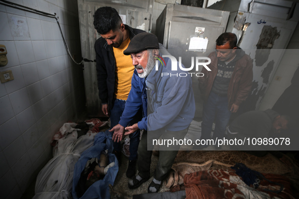 Palestinians are mourning their relatives, who were killed in an overnight Israeli strike on Deir al-Balah, during a mass funeral at the Al-...