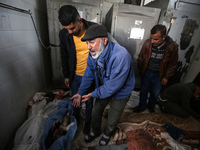 Palestinians are mourning their relatives, who were killed in an overnight Israeli strike on Deir al-Balah, during a mass funeral at the Al-...