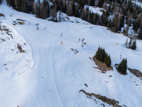 Aerial view of people skiing near Cortina d'Ampezzo, Italy, on February 4, 2024. A mild winter across Europe has resulted in several ski slo...