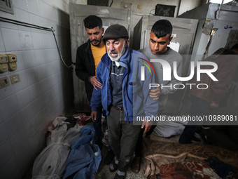 Palestinians are mourning their relatives, who were killed in an overnight Israeli strike on Deir al-Balah, during a mass funeral at the Al-...