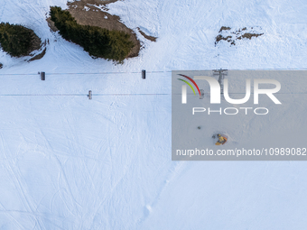 Aerial view of people skiing near Cortina d'Ampezzo, Italy, on February 4, 2024. A mild winter across Europe has resulted in several ski slo...