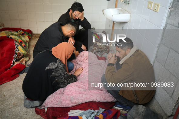 Palestinians are mourning their relatives, who were killed in an overnight Israeli strike on Deir al-Balah, during a mass funeral at the Al-...