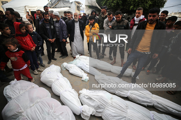 Palestinians are mourning their relatives, who were killed in an overnight Israeli strike on Deir al-Balah, during a mass funeral at the Al-...