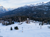 Aerial view of people skiing near Cortina d'Ampezzo, Italy, on February 4, 2024. A mild winter across Europe has resulted in several ski slo...