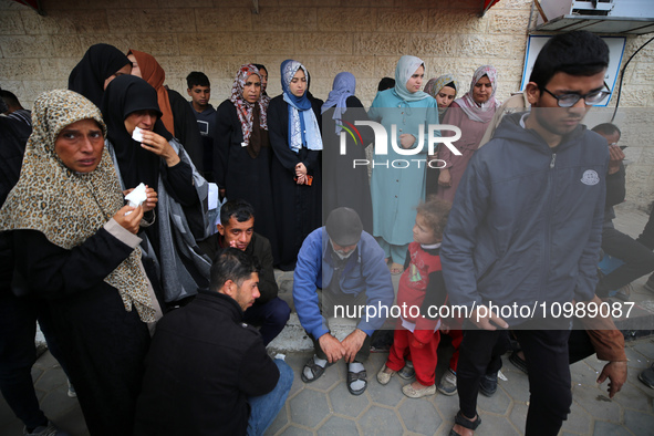 Palestinians are mourning their relatives, who were killed in an overnight Israeli strike on Deir al-Balah, during a mass funeral at the Al-...