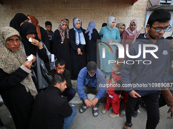 Palestinians are mourning their relatives, who were killed in an overnight Israeli strike on Deir al-Balah, during a mass funeral at the Al-...