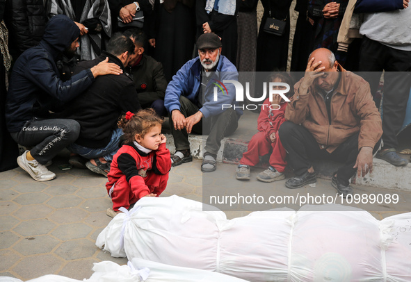 Palestinians are mourning their relatives, who were killed in an overnight Israeli strike on Deir al-Balah, during a mass funeral at the Al-...