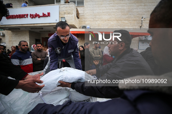 Palestinians are mourning their relatives, who were killed in an overnight Israeli strike on Deir al-Balah, during a mass funeral at the Al-...