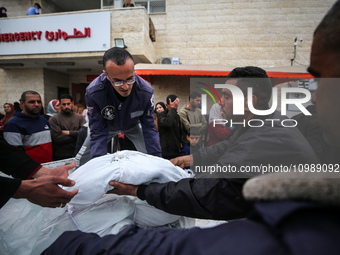 Palestinians are mourning their relatives, who were killed in an overnight Israeli strike on Deir al-Balah, during a mass funeral at the Al-...