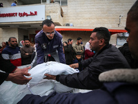 Palestinians are mourning their relatives, who were killed in an overnight Israeli strike on Deir al-Balah, during a mass funeral at the Al-...