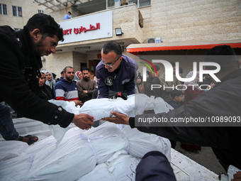 Palestinians are mourning their relatives, who were killed in an overnight Israeli strike on Deir al-Balah, during a mass funeral at the Al-...