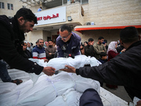 Palestinians are mourning their relatives, who were killed in an overnight Israeli strike on Deir al-Balah, during a mass funeral at the Al-...