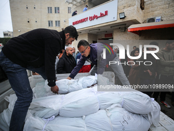 Palestinians are mourning their relatives, who were killed in an overnight Israeli strike on Deir al-Balah, during a mass funeral at the Al-...