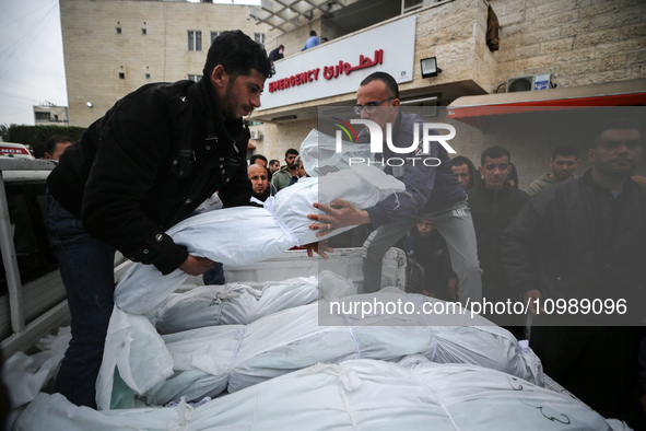 Palestinians are mourning their relatives, who were killed in an overnight Israeli strike on Deir al-Balah, during a mass funeral at the Al-...