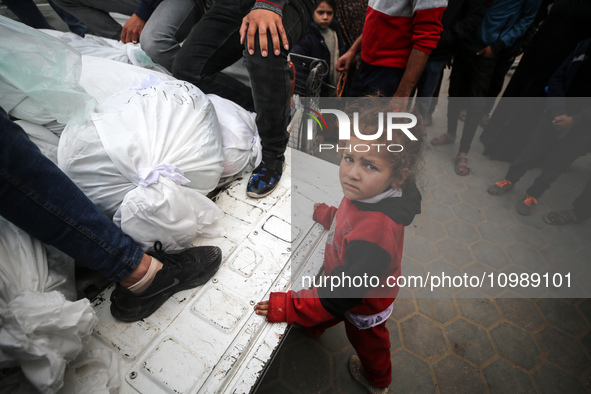 Palestinians are mourning their relatives, who were killed in an overnight Israeli strike on Deir al-Balah, during a mass funeral at the Al-...