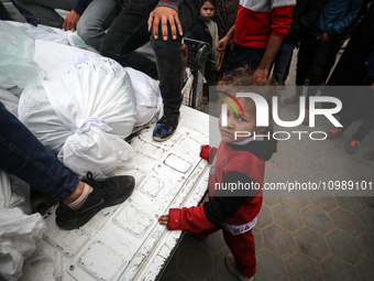 Palestinians are mourning their relatives, who were killed in an overnight Israeli strike on Deir al-Balah, during a mass funeral at the Al-...