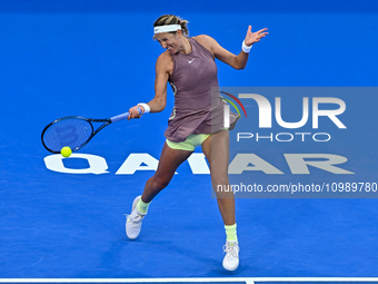 Victoria Azarenka from Belarus is playing in her first-round match against Magdalena Frech of Poland at the WTA 1000-Qatar TotalEnergies Ope...