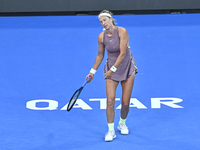 Victoria Azarenka from Belarus is reacting during her first-round match against Magdalena Frech of Poland at the WTA 1000-Qatar TotalEnergie...