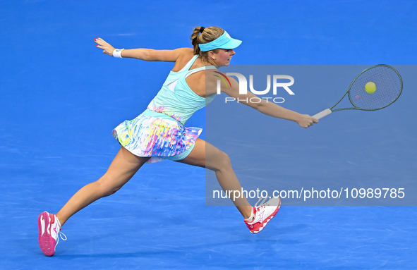 Magdalena Frech of Poland is in action during her first-round match against Victoria Azarenka of Belarus at the WTA 1000-Qatar TotalEnergies...