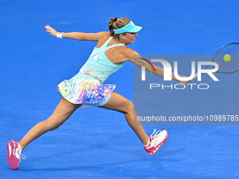 Magdalena Frech of Poland is in action during her first-round match against Victoria Azarenka of Belarus at the WTA 1000-Qatar TotalEnergies...