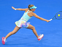 Magdalena Frech of Poland is in action during her first-round match against Victoria Azarenka of Belarus at the WTA 1000-Qatar TotalEnergies...