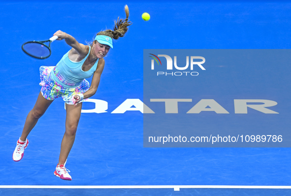 Magdalena Frech of Poland is in action during her first-round match against Victoria Azarenka of Belarus at the WTA 1000-Qatar TotalEnergies...