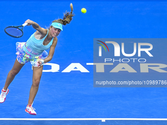 Magdalena Frech of Poland is in action during her first-round match against Victoria Azarenka of Belarus at the WTA 1000-Qatar TotalEnergies...