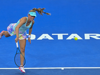 Magdalena Frech of Poland is in action during her first-round match against Victoria Azarenka of Belarus at the WTA 1000-Qatar TotalEnergies...