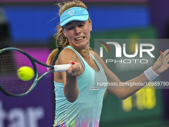 Magdalena Frech of Poland is in action during her first-round match against Victoria Azarenka of Belarus at the WTA 1000-Qatar TotalEnergies...