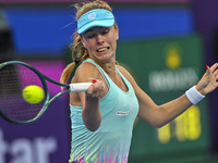 Magdalena Frech of Poland is in action during her first-round match against Victoria Azarenka of Belarus at the WTA 1000-Qatar TotalEnergies...