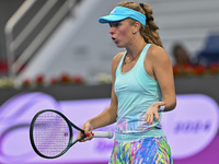 Magdalena Frech of Poland is reacting during her first-round match against Victoria Azarenka of Belarus at the WTA 1000-Qatar TotalEnergies...