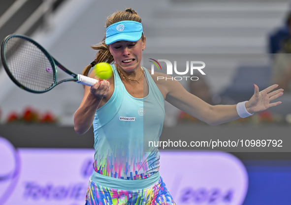 Magdalena Frech of Poland is in action during her first-round match against Victoria Azarenka of Belarus at the WTA 1000-Qatar TotalEnergies...