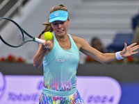 Magdalena Frech of Poland is in action during her first-round match against Victoria Azarenka of Belarus at the WTA 1000-Qatar TotalEnergies...