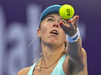 Magdalena Frech of Poland is in action during her first-round match against Victoria Azarenka of Belarus at the WTA 1000-Qatar TotalEnergies...