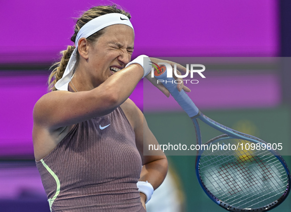 Victoria Azarenka of Belarus is reacting during her first-round match against Magdalena Frech of Poland at the WTA 1000-Qatar TotalEnergies...