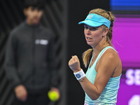 Victoria Azarenka of Belarus is reacting during her first-round match against Magdalena Frech of Poland at the WTA 1000-Qatar TotalEnergies...