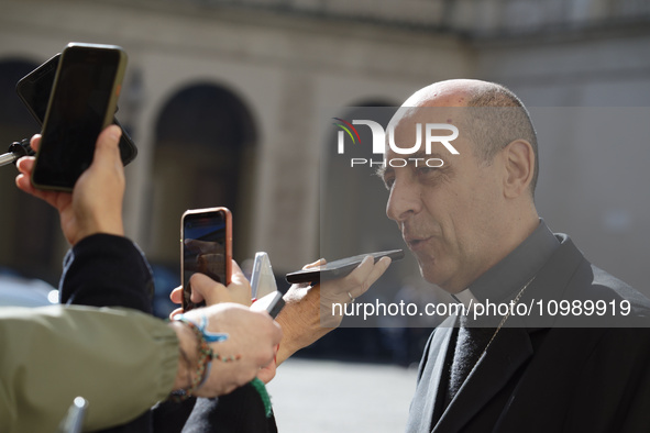 Cardinal Victor Manuel Fernandez is talking to reporters in the St. Damaso courtyard during the audience of Argentinian President Javier Mil...