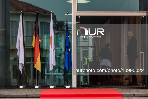 The flags of Cyprus, Germany, the EU, and the Nicosia municipality are being displayed outside the Town Hall in Nicosia, Cyprus, on February...