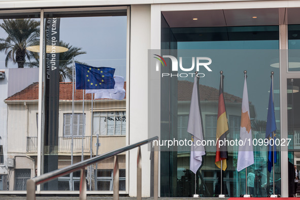 The flags of Cyprus, Germany, the EU, and the Nicosia municipality are being displayed outside the Town Hall in Nicosia, Cyprus, on February...