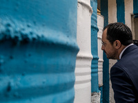 Nikos Christodoulides is looking through the barricade to the occupied part of Nicosia, Cyprus, on February 12, 2024. The President of Germa...