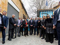 Constantinos Yiorkadjis, Frank-Walter Steinmeier, and Nikos Christodoulides are posing in front of a barricade in Nicosia, Cyprus, on Februa...