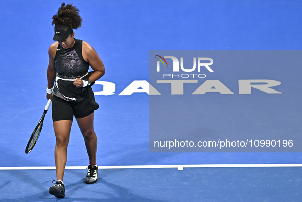 Naomi Osaka of Japan is reacting during her first-round match against Caroline Garcia of France at the WTA 1000-Qatar TotalEnergies Open ten...