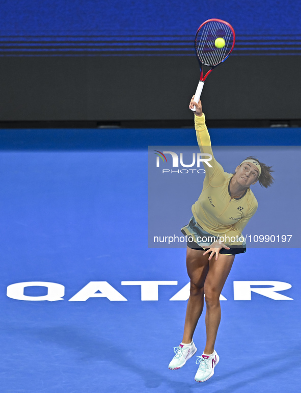 Caroline Garcia of France is in action during her first-round match against Naomi Osaka of Japan at the WTA 1000-Qatar TotalEnergies Open te...