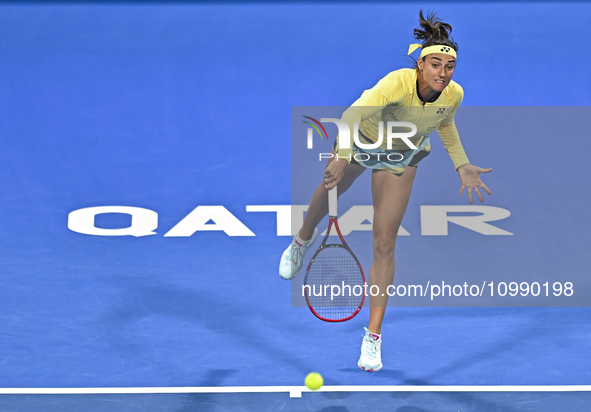 Caroline Garcia of France is in action during her first-round match against Naomi Osaka of Japan at the WTA 1000-Qatar TotalEnergies Open te...