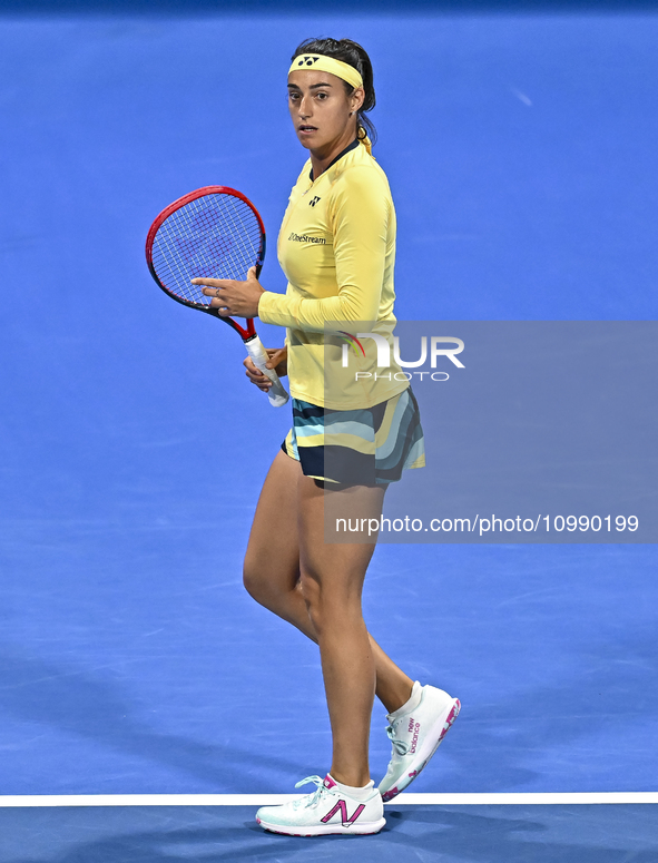 Caroline Garcia of France is reacting during her first-round match against Naomi Osaka of Japan at the WTA 1000-Qatar TotalEnergies Open ten...