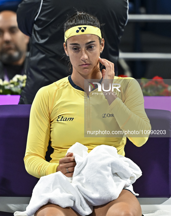 Caroline Garcia of France is reacting during her first-round match against Naomi Osaka of Japan at the WTA 1000-Qatar TotalEnergies Open ten...