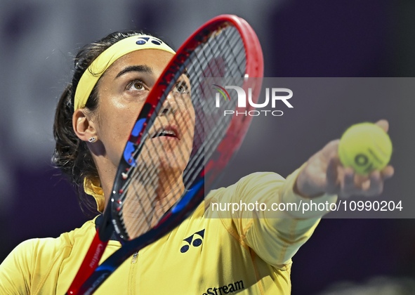 Caroline Garcia of France is in action during her first-round match against Naomi Osaka of Japan at the WTA 1000-Qatar TotalEnergies Open te...